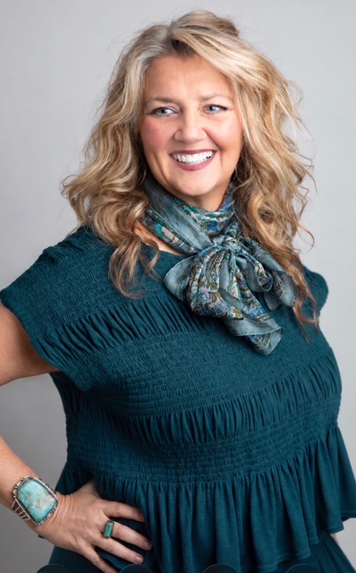 Melanie Massey, founder of MoCo Leadership, in her signature deep teal
